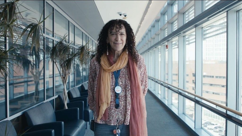Annekathryn smiling by windows