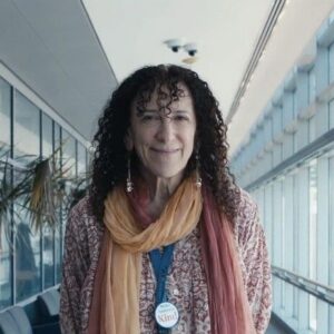 Annekathryn smiling by windows